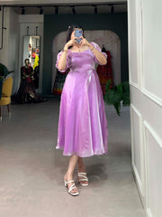 Rich purple frock in smooth Burberry silk , Plain purple silk frock with 4-meter flair , Elegant purple color frock with micro cotton lining ,  Partywear purple frock with stitched sleeves , Designer purple silk frock for women , Purple flared frock for festive and traditional wear .